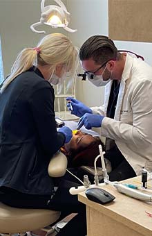 Dentist looking at intraoral images
