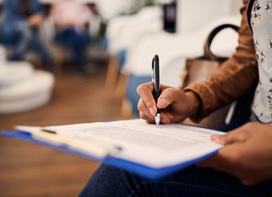 Woman filling out dental insurance form 