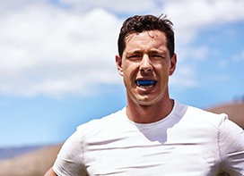 Athletic man wearing mouthguard