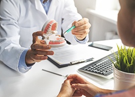 Dentist talking to patient about root canal treatment