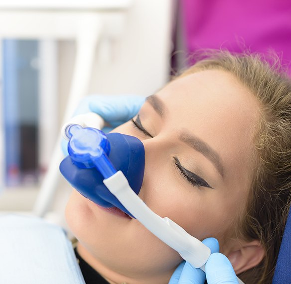 Female dental patient relaxed under nitrous oxide sedation dentistry