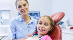 Young girl smiling after children's dentistry visit