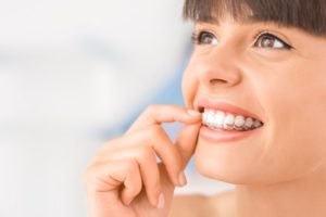 Woman smiling with Invisalign