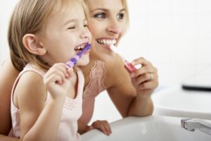 mother & daughter brushing 