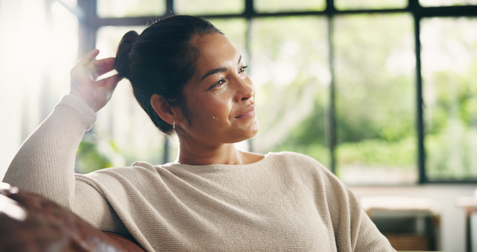 relaxed woman sitting on couch